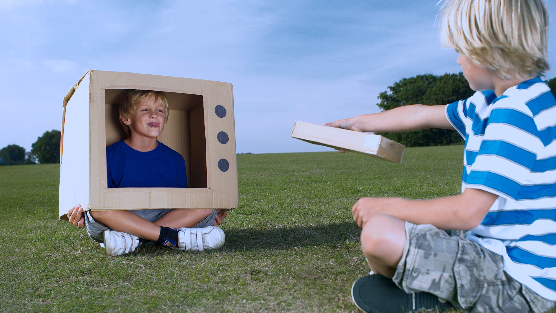 Child pressing a toy television handheld