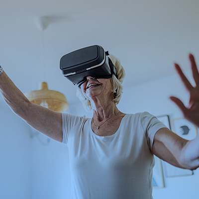 Woman using virtual reality glasses to access the Metaverse
